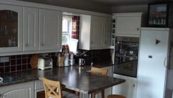kitchen with breakfast bar and wooden fixtures