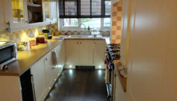 cream kitchen with floor spotlights