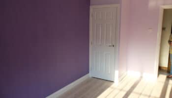garage conversion with purple walls