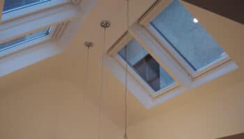 velux windows with three lights hanging from ceiling