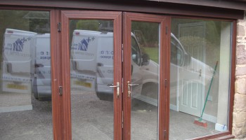 wooden door with glass panels