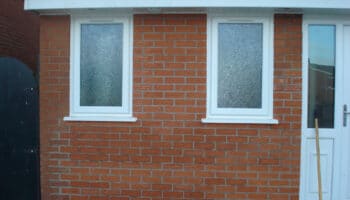 completed garage conversion with frosted glass windows